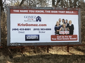 There is too much going on in this billboard. If someone where driving past it, they wouldn't know which number to write down. Also the font is too small. They have 2 logos and their tagline at the top gets lost.